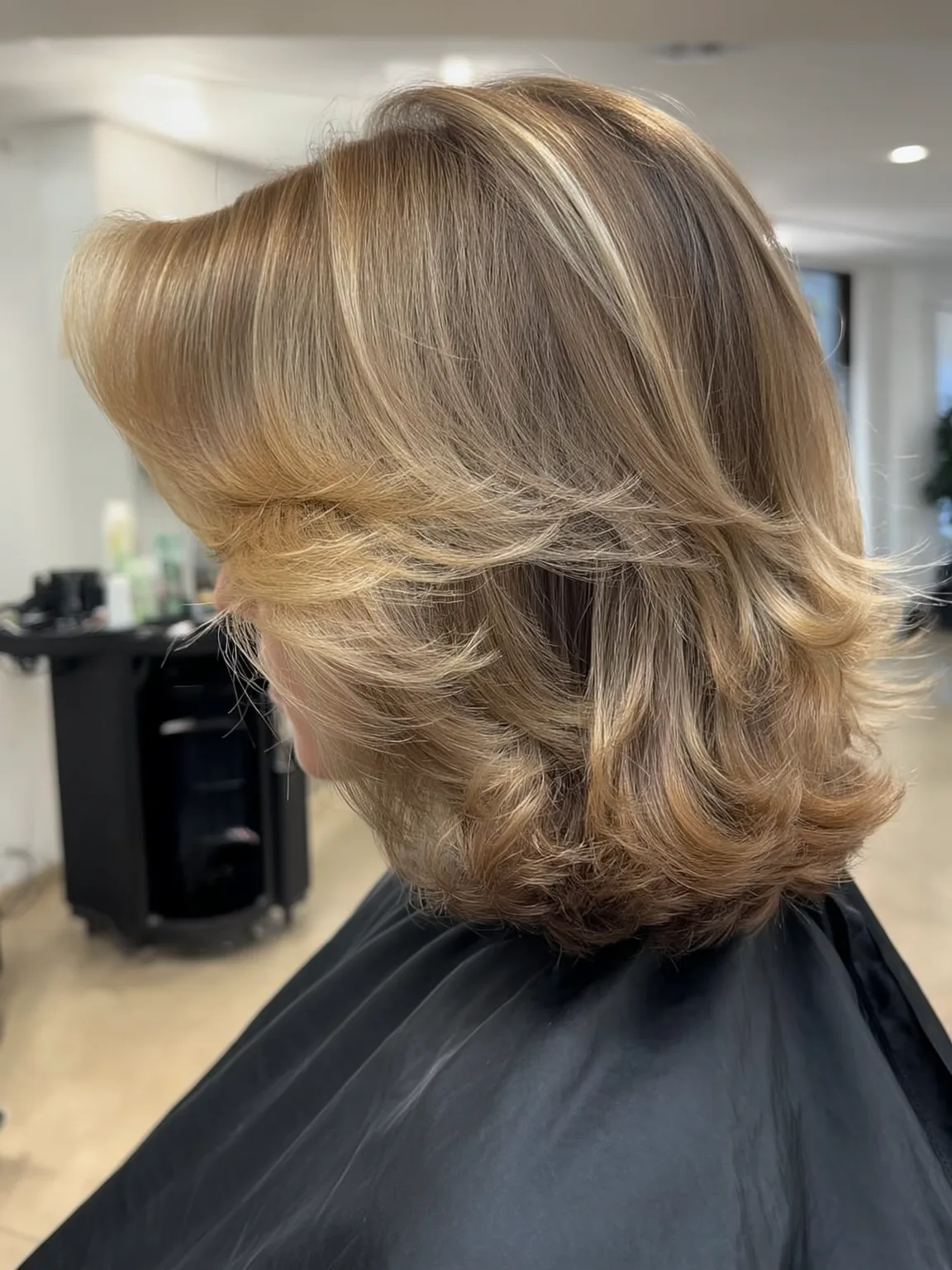 Feathered Medium Layers with Honey Blonde Highlights